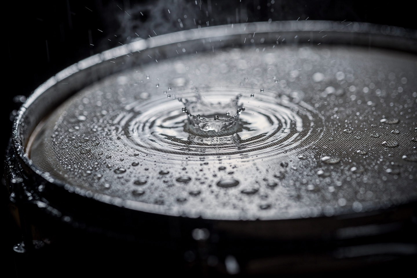 Raindrops drumming on a membrane — the same physics of impacts