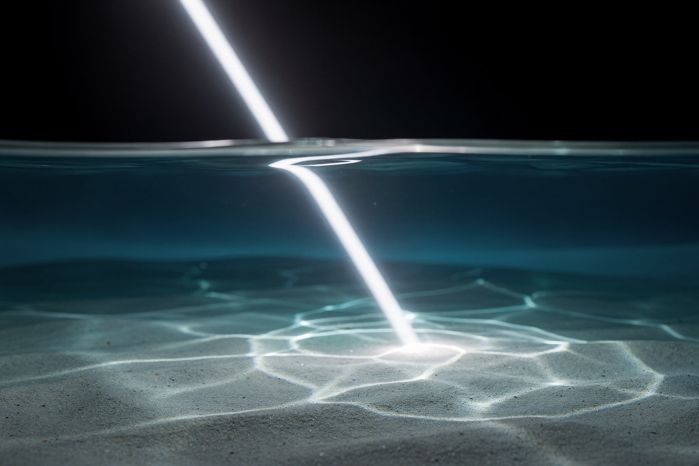 A light ray bending as it enters water
